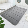 Tapis de salle de bain en velours avec motif géométrique en relief