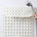 Tapis de bain antidérapant avec surface de massage pour les pieds